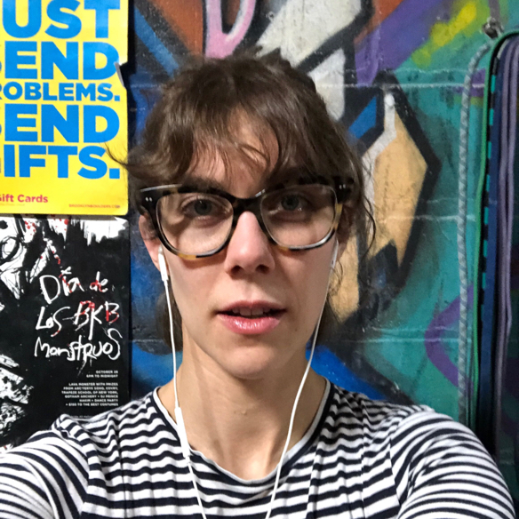 Sweaty woman with glasses and striped shirt against colorful backdrop