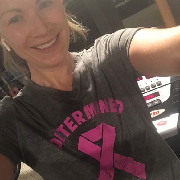 Half length shot of sweaty woman with grey t-shirt